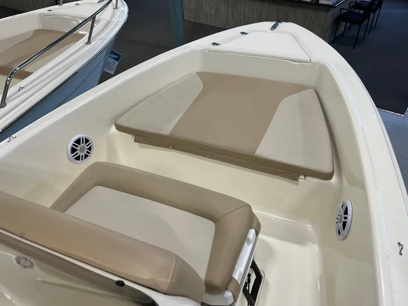 Slide: The Image of 2024 Scout 175 Sportfish boat interior with beige seating and speakers. - 5