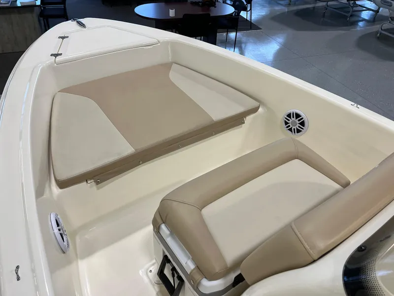 Slide: The Image of 2024 Scout 175 Sportfish boat interior with beige seating and speakers. - 6