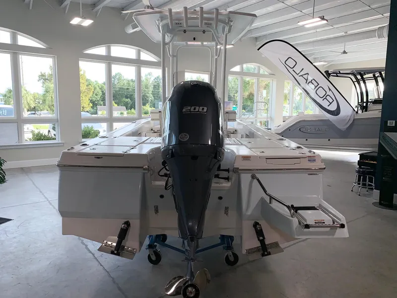 Slide: The Image of 2024 Robalo 226 Cayman boat with Yamaha 200 engine in showroom. - 3