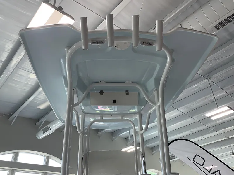 Slide: The Image of 2024 Robalo 226 Cayman T-top structure in showroom. - 20