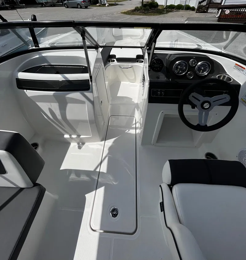 Slide: The Image of 2024 Bayliner VR4 boat interior with steering wheel and dashboard. - 10