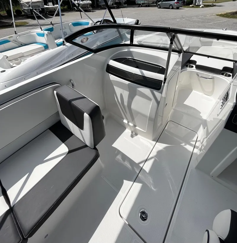 Slide: The Image of 2024 Bayliner VR4 boat interior with seating and console. - 11