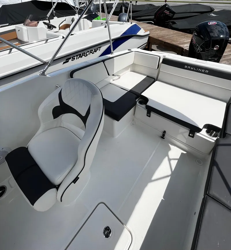 Slide: The Image of 2024 Bayliner VR4 boat interior with seating and storage compartments. - 8
