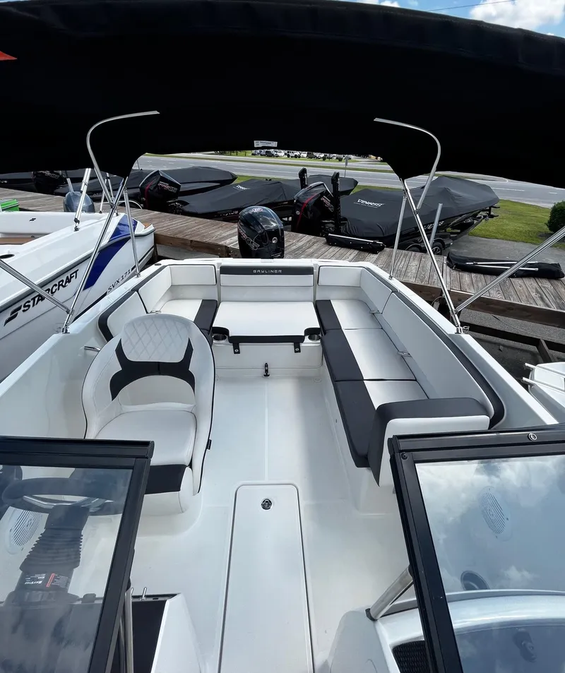 Slide: The Image of 2024 Bayliner VR4 boat interior with seating and steering wheel. - 4