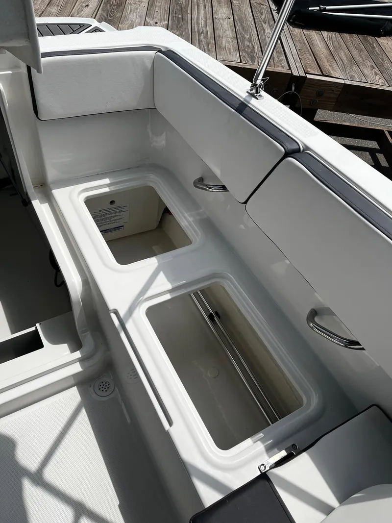 Slide: The Image of 2024 Bayliner VR4 boat interior storage compartments. - 6