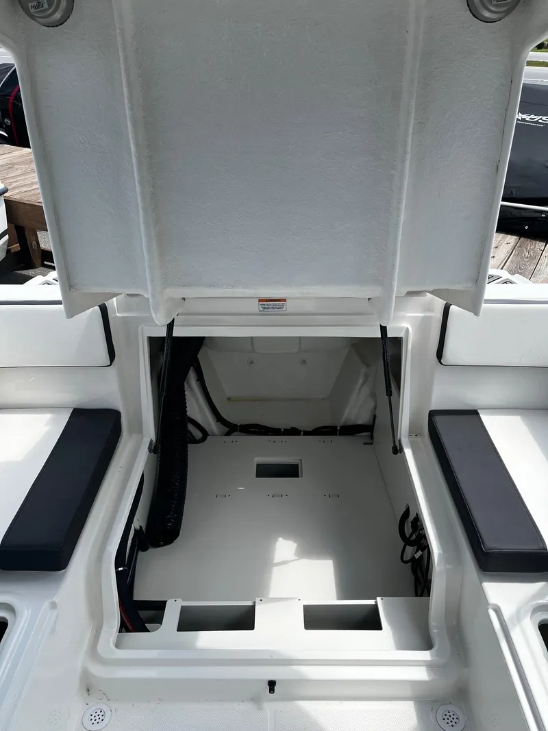 Slide: The Image of 2024 Bayliner VR4 boat storage compartment with open hatch. - 7