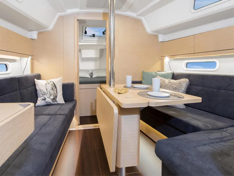 Slide: The Image of Modern interior of 2024 Hanse 348 sailboat with cozy seating and dining area. - 11