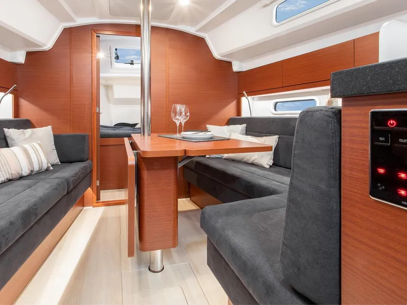 Slide: The Image of Modern interior of 2024 Hanse 348 sailboat with cozy seating and dining area. - 18