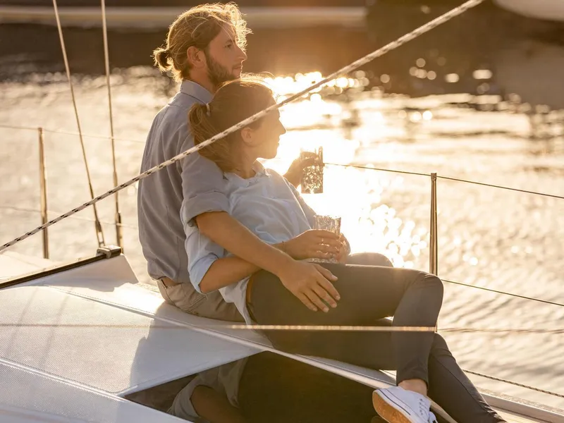 Slide: The Image of Couple relaxing on 2024 Hanse 348 sailboat at sunset. - 30