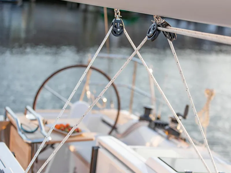 Slide: The Image of Close-up of 2024 Hanse 348 sailboat cockpit with rigging and steering wheel. - 4