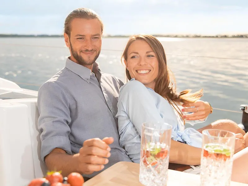 Slide: The Image of Couple enjoying a sunny day on a 2024 Hanse 348 sailboat. - 7
