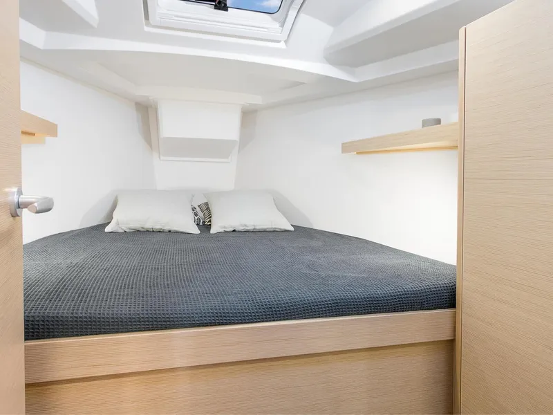 Slide: The Image of 2024 Hanse 348 yacht interior cabin with double bed and skylight. - 13