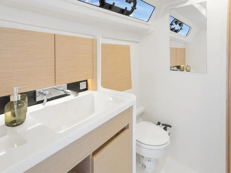 Slide: The Image of Modern bathroom in 2024 Hanse 348 yacht with sink, mirror, and toilet. - 15