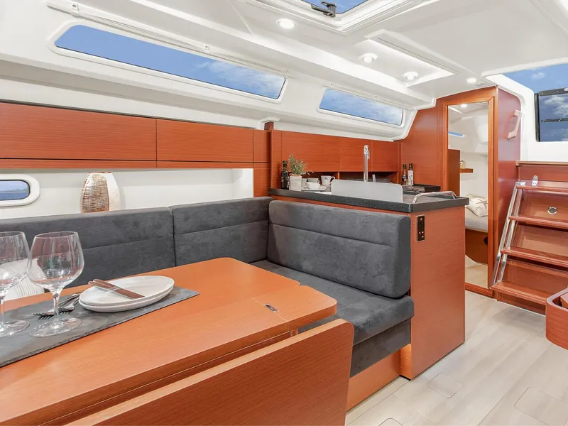 Slide: The Image of 2024 Hanse 348 yacht interior with modern kitchen and dining area. - 17
