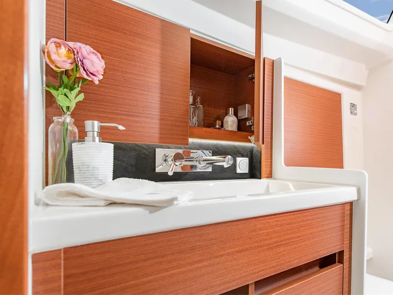 Slide: The Image of Modern bathroom vanity in 2024 Hanse 348 yacht with wooden cabinets and elegant fixtures. - 22