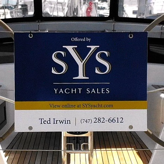 Slide: The Image of SYS Yacht Sales sign on 2025 Hanse 348 sailboat, contact Ted Irwin. - 3