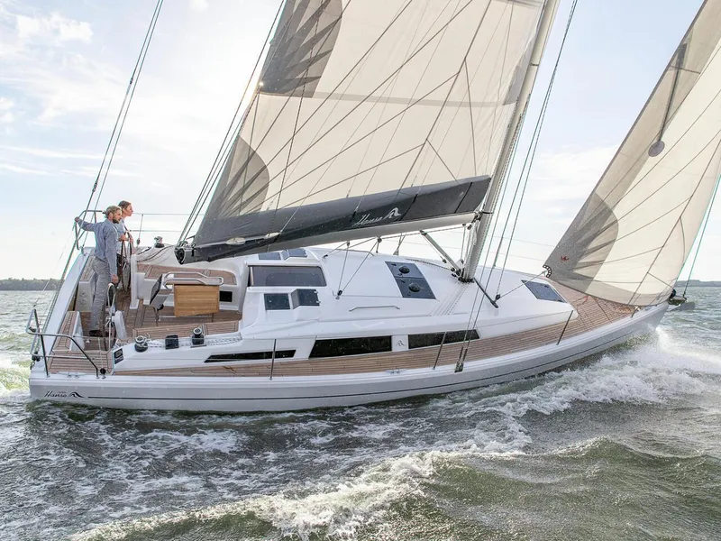Slide: The Image of 2024 Hanse 348 sailing yacht on the water with sails up. - 31