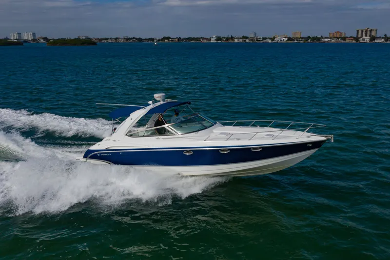 Slide: The Image of 2007 Formula 370 Super Sport cruising on open water, showcasing sleek design and performance. - 10