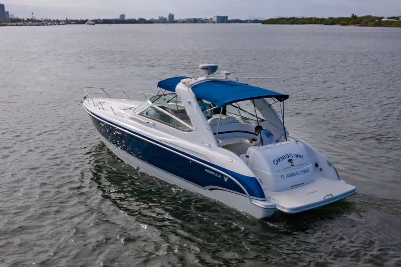 Slide: The Image of 2007 Formula 370 Super Sport boat cruising on calm waters. - 2