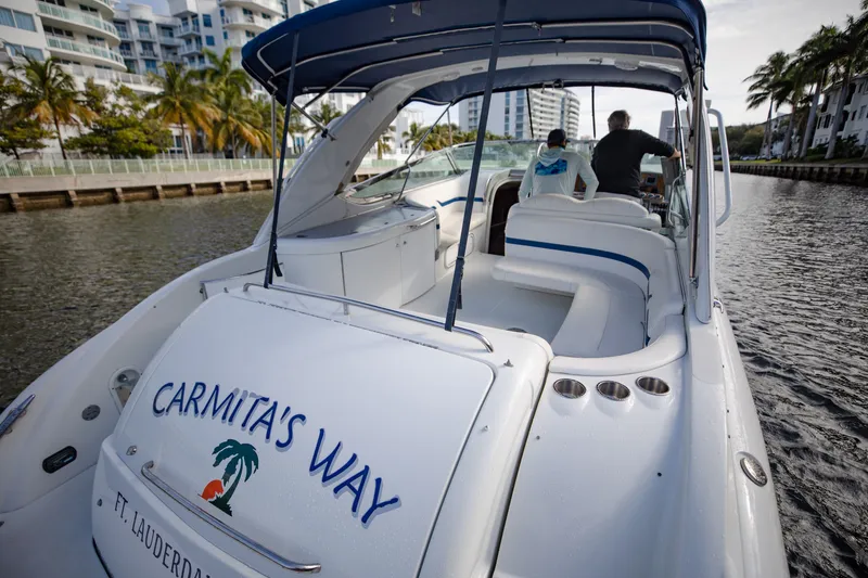 Slide: The Image of 2007 Formula 370 Super Sport boat named "Carmita's Way" cruising in Fort Lauderdale canal. - 35