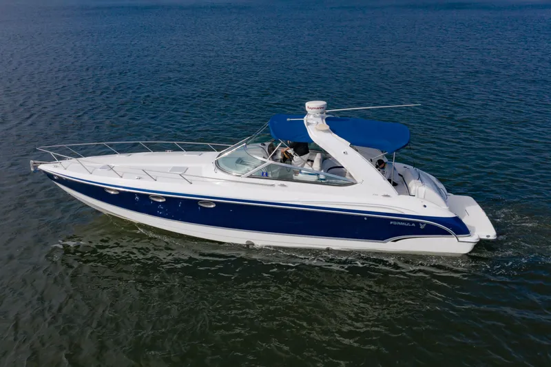 Slide: The Image of 2007 Formula 370 Super Sport boat cruising on open water. - 4