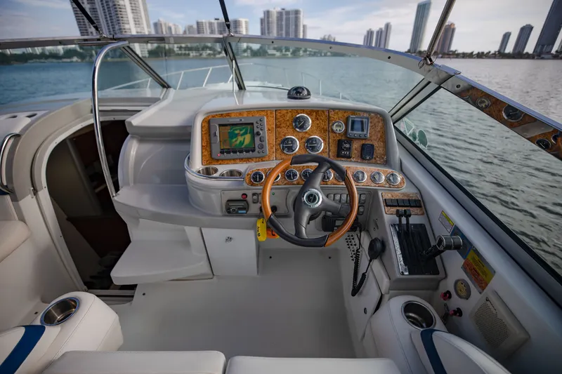 Slide: The Image of 2007 Formula 370 Super Sport boat cockpit with city skyline in background. - 43