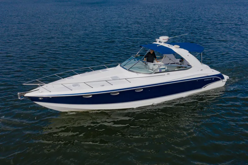 Slide: The Image of 2007 Formula 370 Super Sport boat cruising on open water. - 5