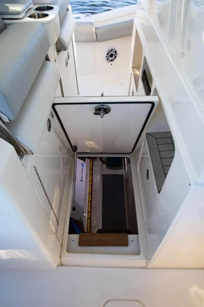 Slide: The Image of 2025 Scout 425 LXF boat interior with open storage compartment. - 11