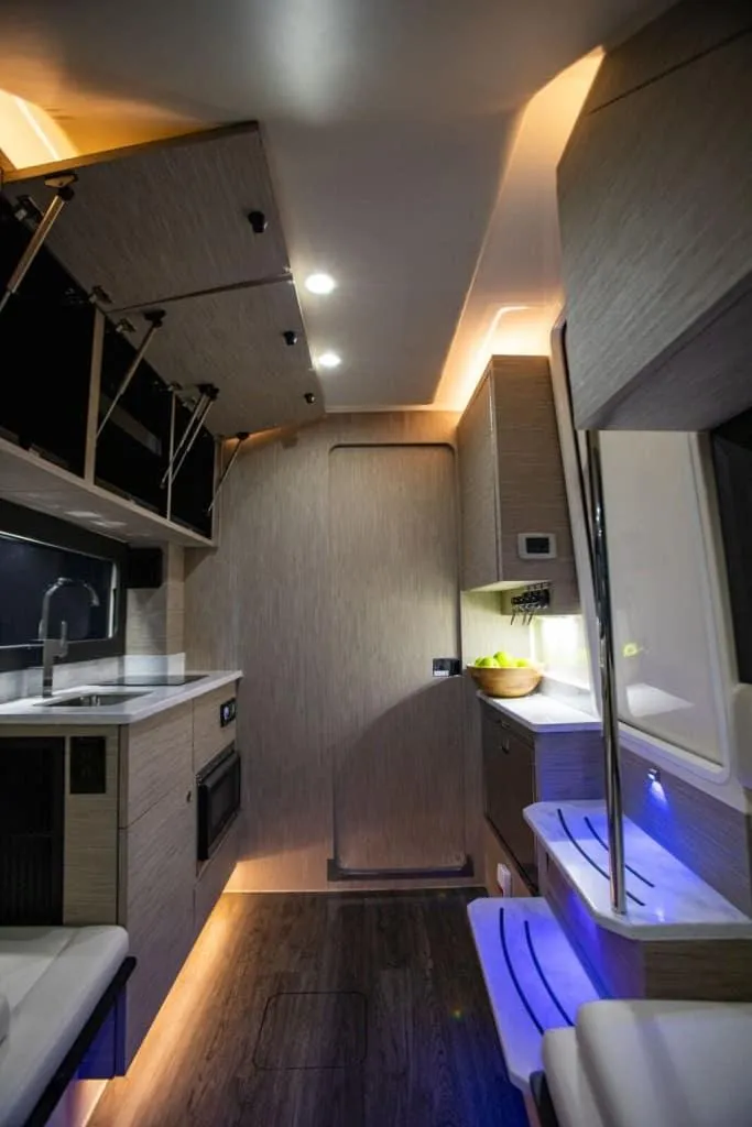 Slide: The Image of Luxurious interior of 2025 Scout 425 LXF boat with modern lighting and sleek design. - 12