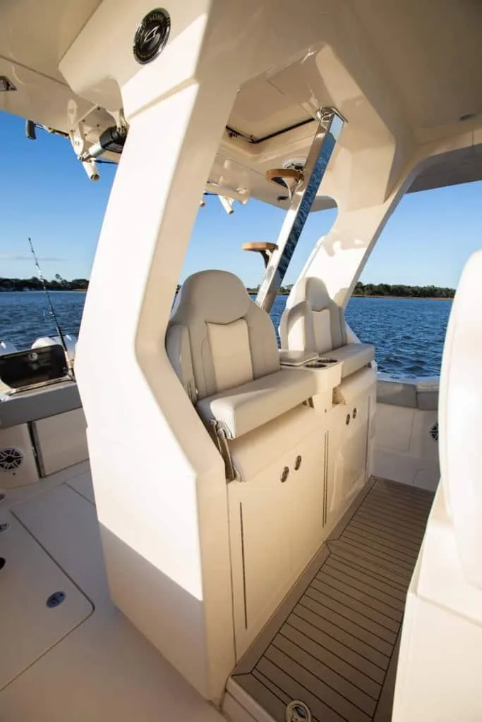 Slide: The Image of 2025 Scout 425 LXF boat interior with luxurious seating and ocean view. - 3