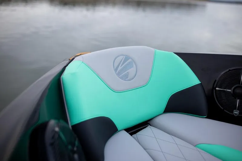 Slide: The Image of 2023 Tigé Z3 boat interior with teal and gray seating. - 6