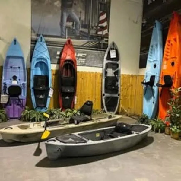 The Image of Display of colorful Ascend kayaks, including 2021 Ascend 9R Sport Sit-On models. - 0