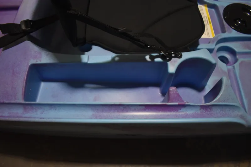 Slide: The Image of 2021 Ascend 9R Sport Sit-On kayak seat and storage area, blue and purple design. - 10