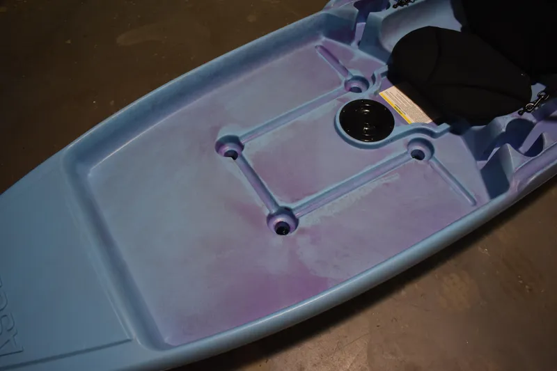 Slide: The Image of 2021 Ascend 9R Sport Sit-On kayak, blue and purple deck, with seat and storage hatch. - 5