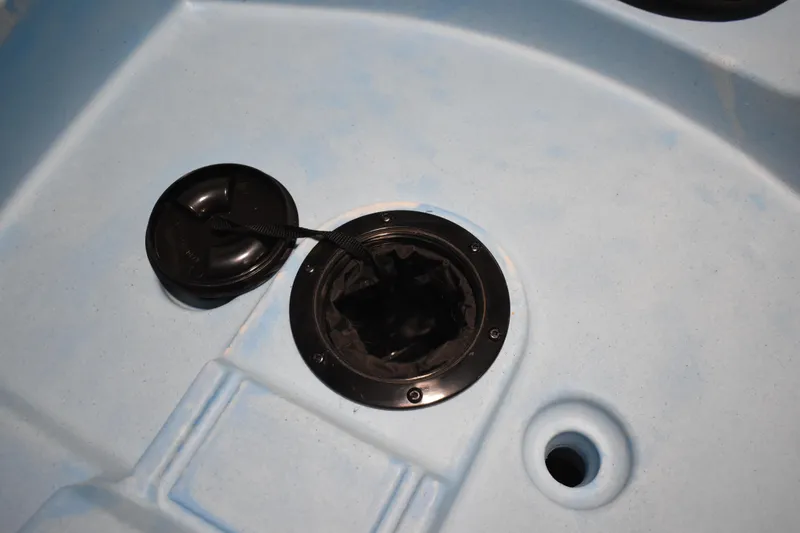 Slide: The Image of Open hatch on 2021 Ascend 12R Sport Sit-On kayak, showing interior compartment. - 10