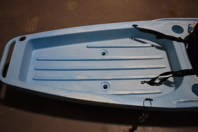 Slide: The Image of Blue Ascend 12R Sport Sit-On kayak, 2021 model, featuring a spacious deck design. - 12