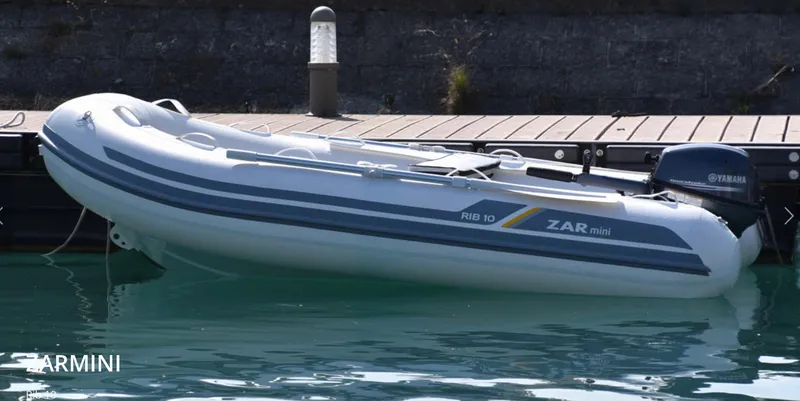 Slide: The Image of 2022 ZAR Mini Rib HDL10 inflatable boat docked with Yamaha motor. - 11