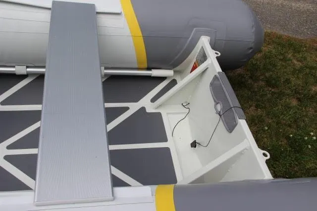 Slide: The Image of 2022 ZAR Mini Rib HDL10 inflatable boat interior with seating and storage. - 7