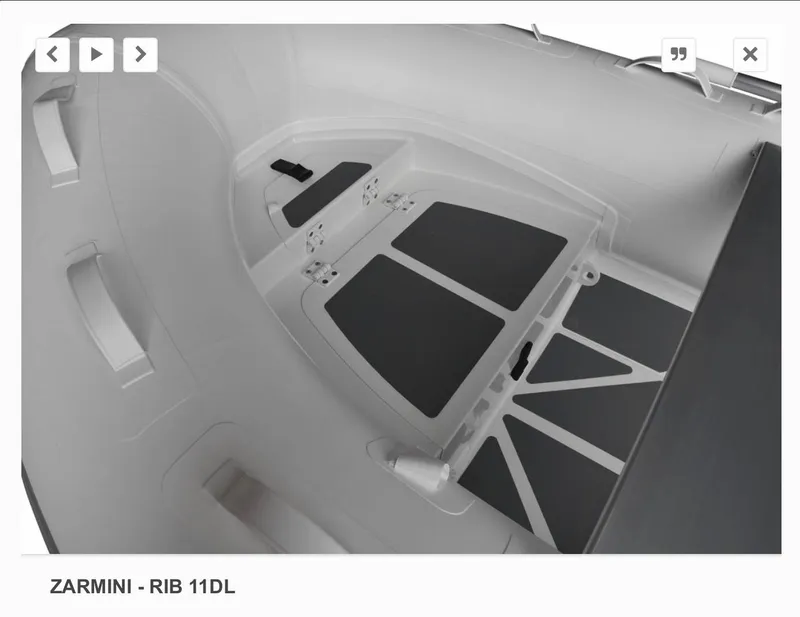 Slide: The Image of 2022 ZAR Mini 11 HDL inflatable boat interior, featuring non-slip flooring and storage compartments. - 2