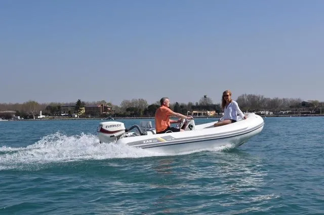 Slide: The Image of 2023 ZAR Mini LUX 12 boat cruising on a sunny day. - 3