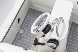 Slide: The Image of 2023 ZAR Mini LUX 12 boat interior with steering wheel and controls. - 9