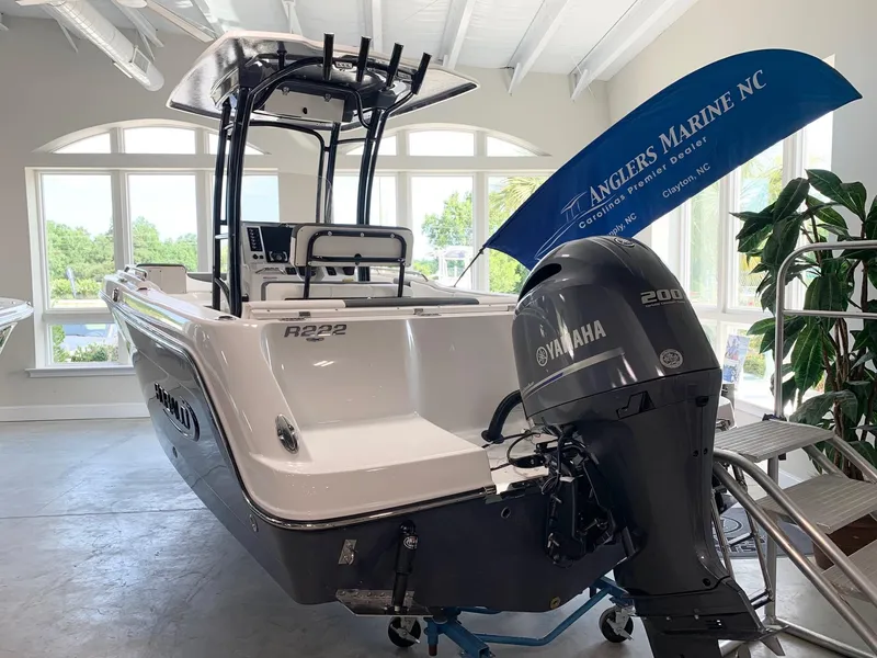 Slide: The Image of 2024 Robalo R222 boat with Yamaha 200 engine at Anglers Marine NC showroom. - 1
