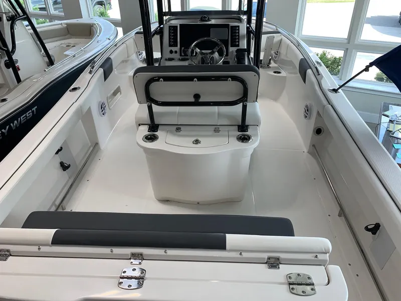 Slide: The Image of 2024 Robalo R222 boat interior with seating and control console. - 12