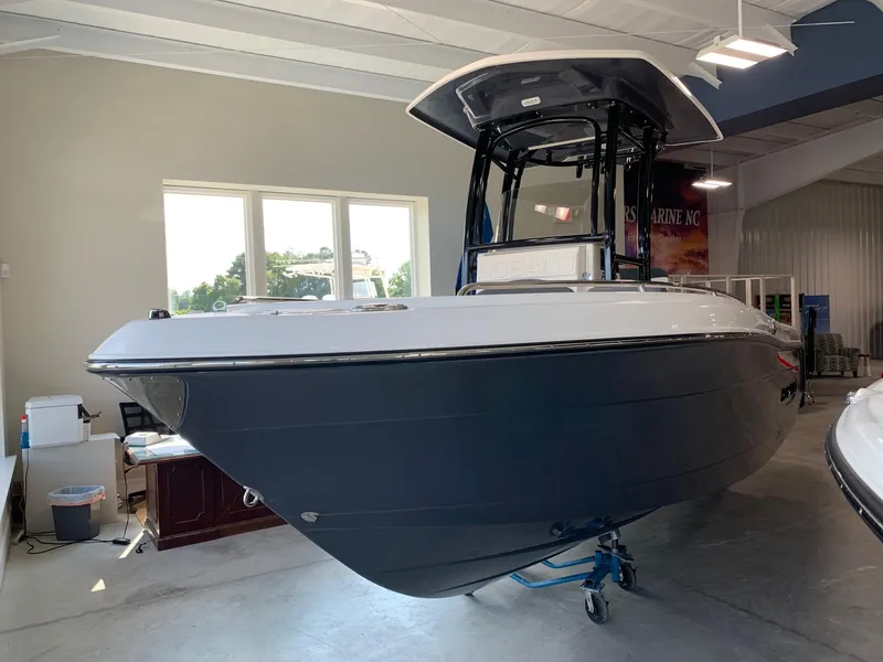 Slide: The Image of 2024 Robalo R222 boat displayed indoors. - 2