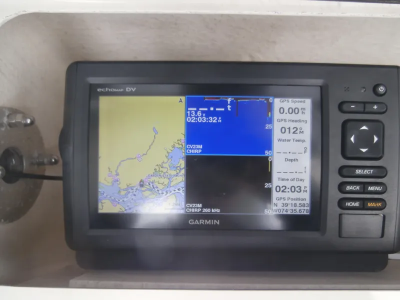 Slide: The Image of Garmin GPS display on 2004 Grady-White 22 FISHERMAN boat, showing navigation and depth data. - 10