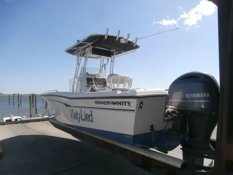 Slide: The Image of 2004 Grady-White 22 Fisherman boat with Yamaha outboard motor at dockside. - 13