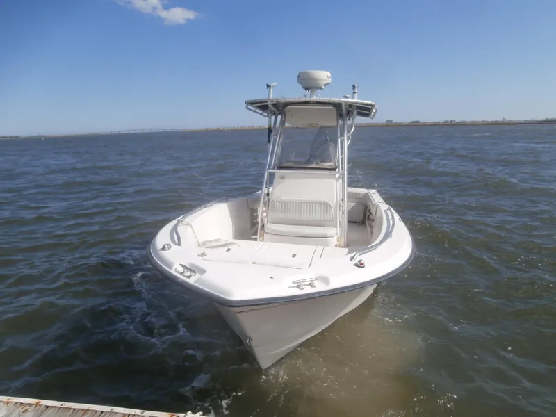 Slide: The Image of 2004 Grady-White 22 FISHERMAN boat on open water, clear sky background. - 3