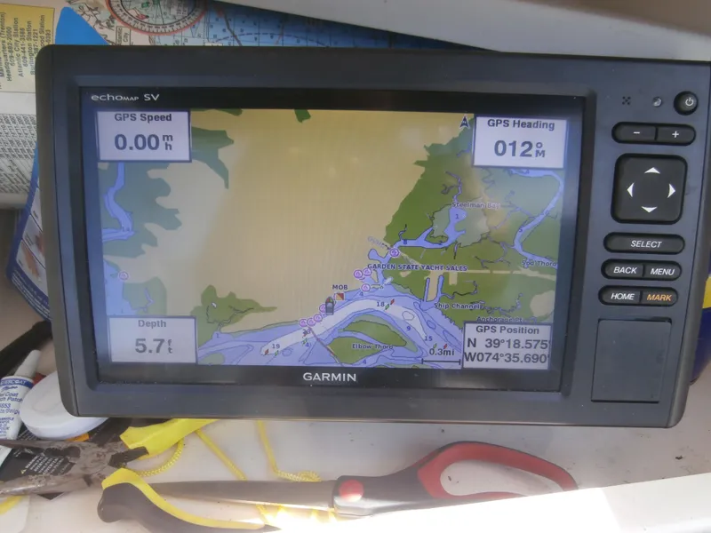 Slide: The Image of Garmin GPS device on 2004 Grady-White 22 FISHERMAN, displaying navigation map and coordinates. - 4