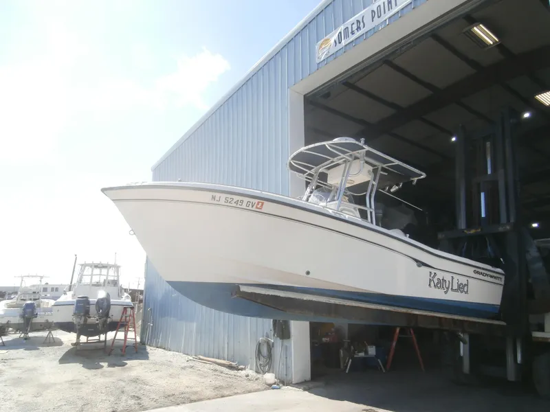 Slide: The Image of 2004 Grady-White 22 FISHERMAN boat in storage facility, partially lifted, side view. - 5