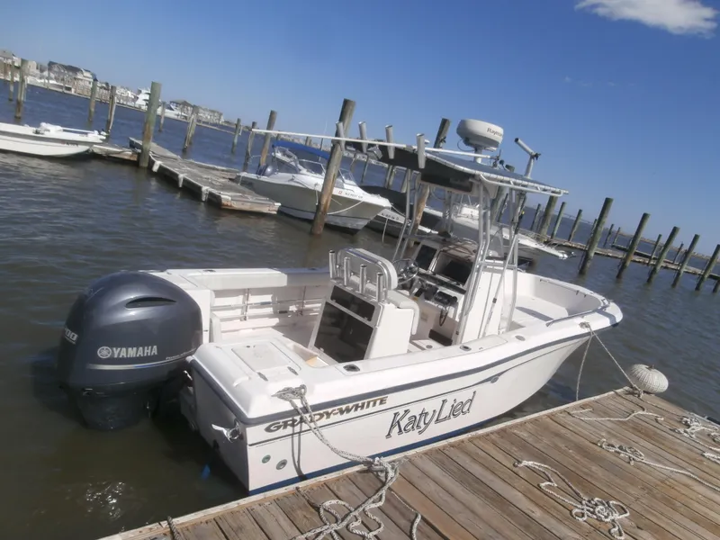 Slide: The Image of 2004 Grady-White 22 FISHERMAN boat docked with Yamaha outboard motor. - 6
